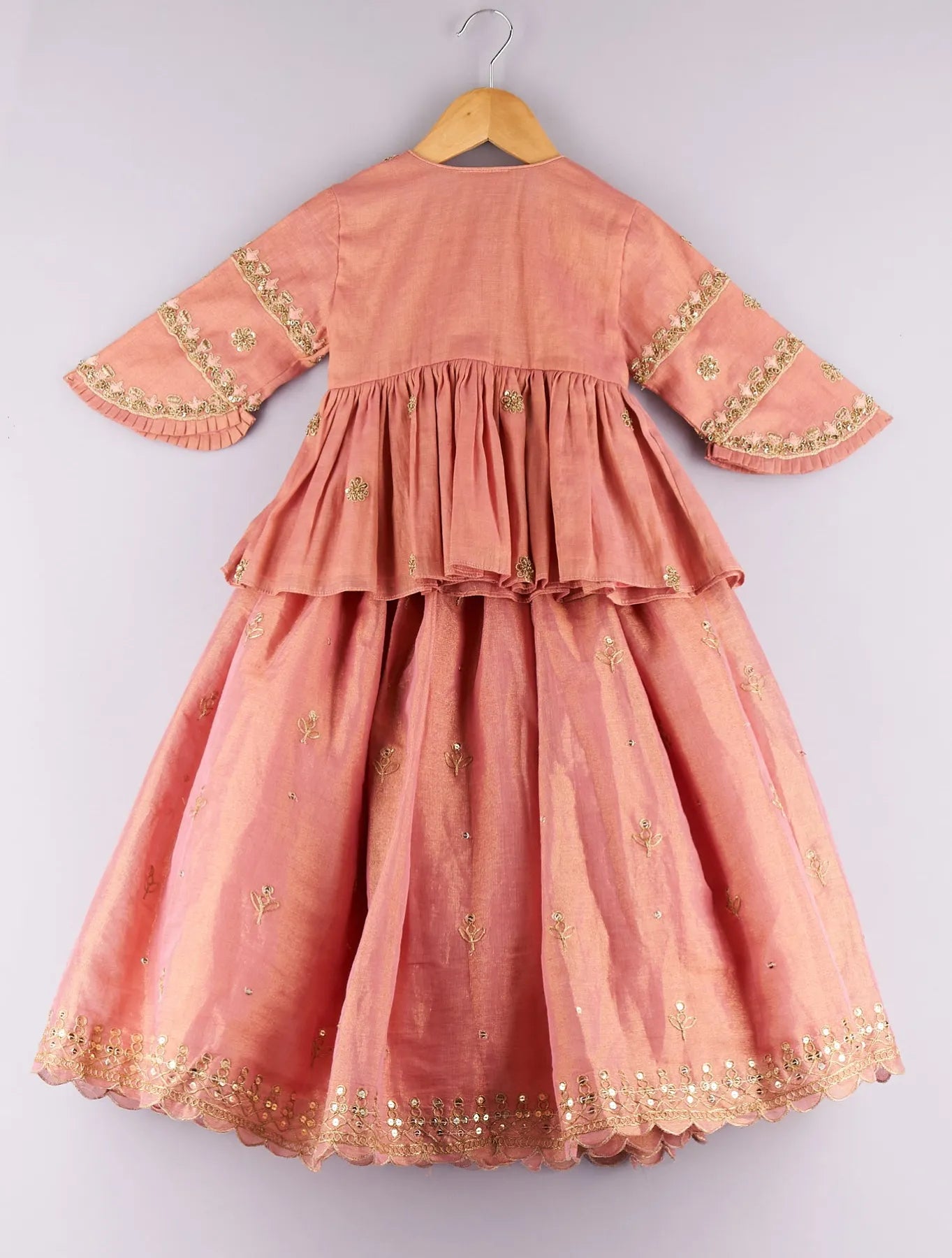 Sequence and zari work peach peplum top with embroidered lehenga